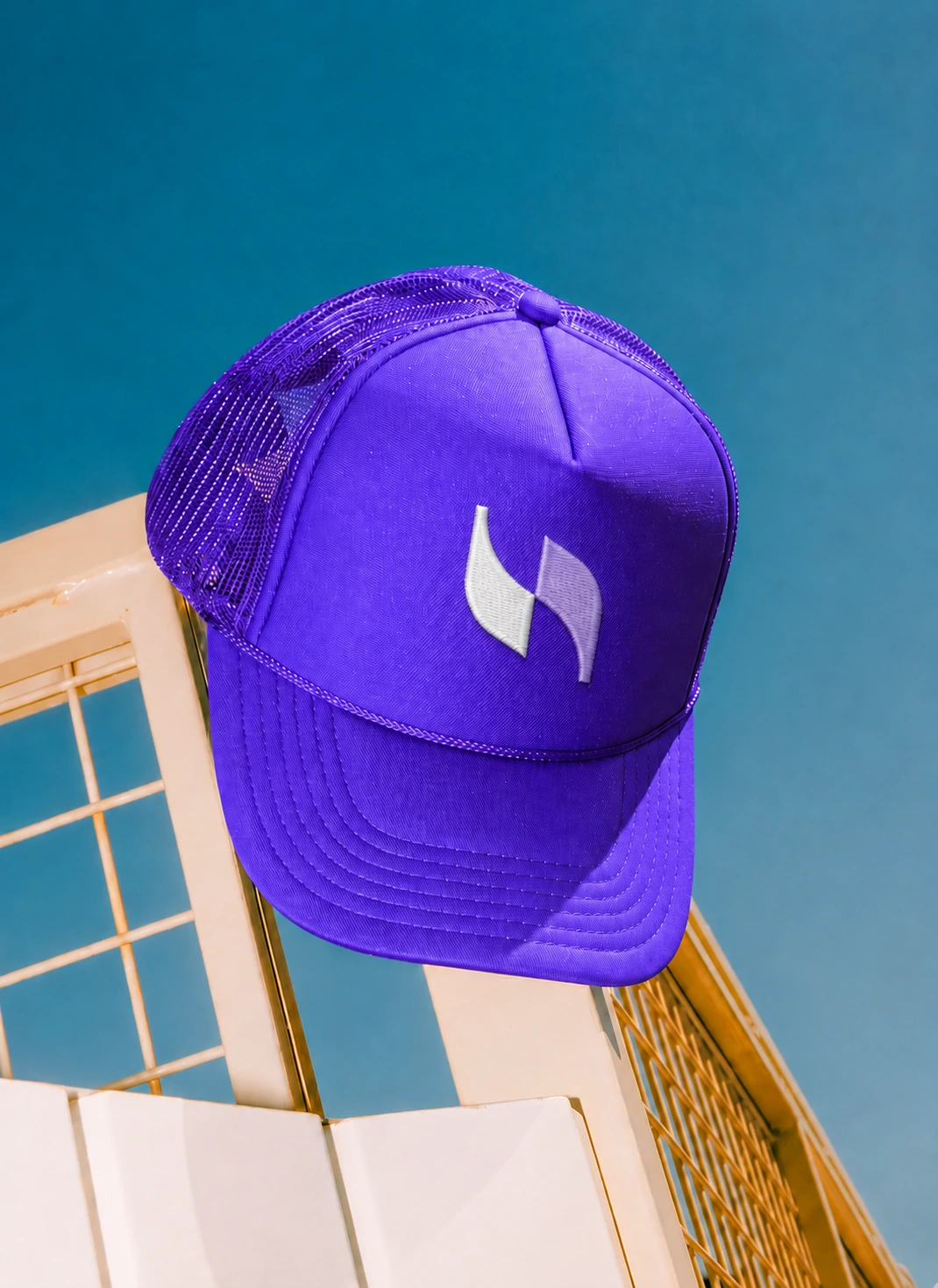 Violet Tazmify cap with an embroidered ribbon logo